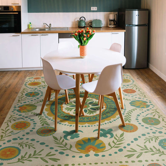 a kitchen with a colorful rug under a dining table