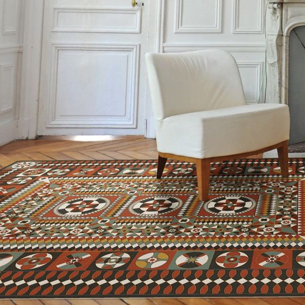 a bold geometric patterned vinyl rug in a living room