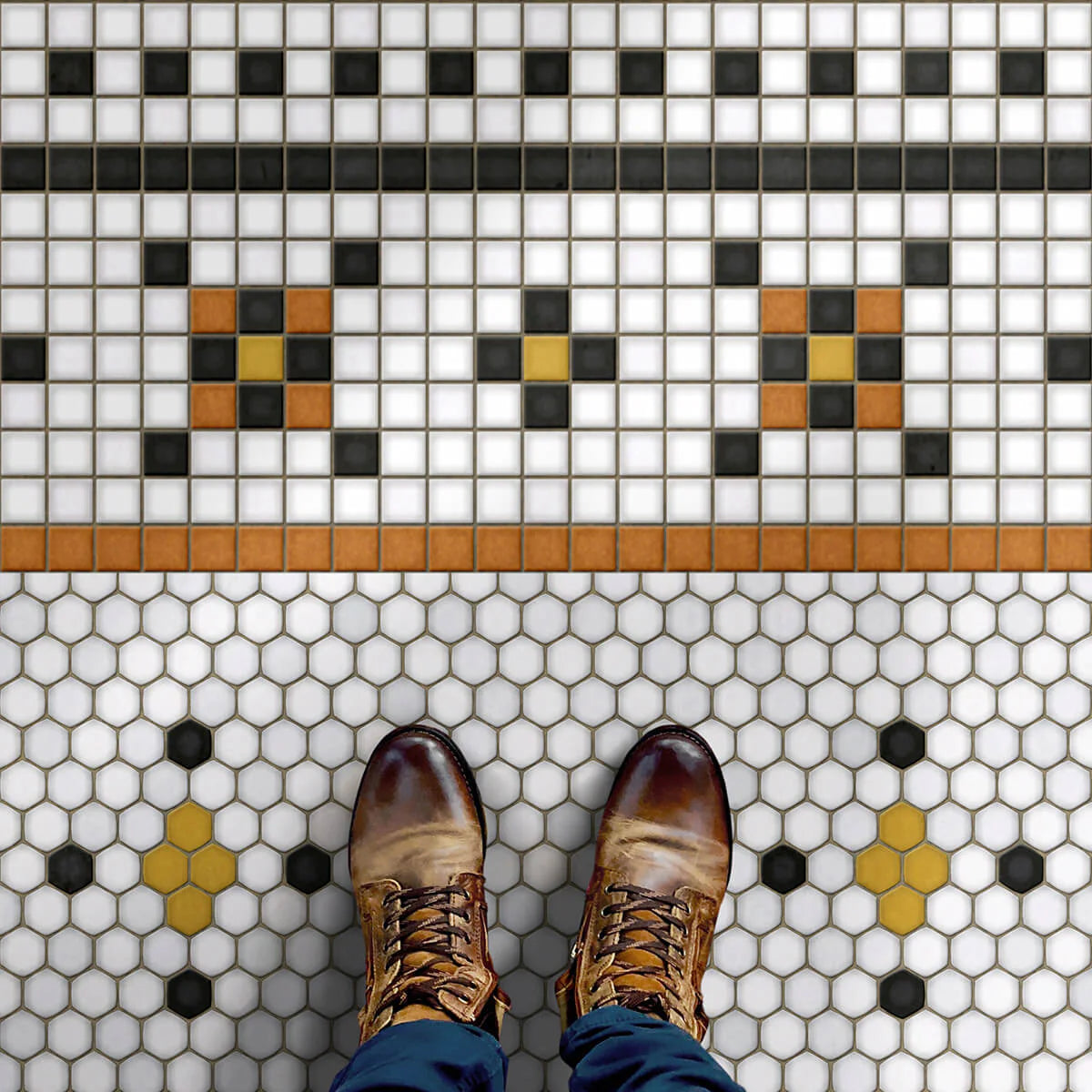person in boots standing on mosaic tile rug
