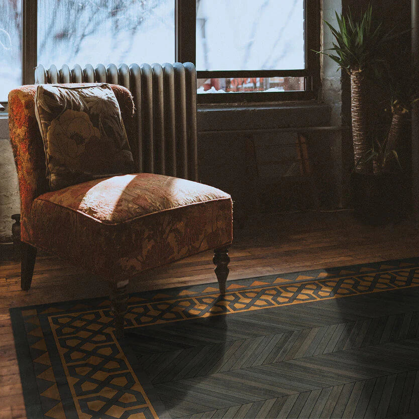 wood print artisan rug with vintage chair